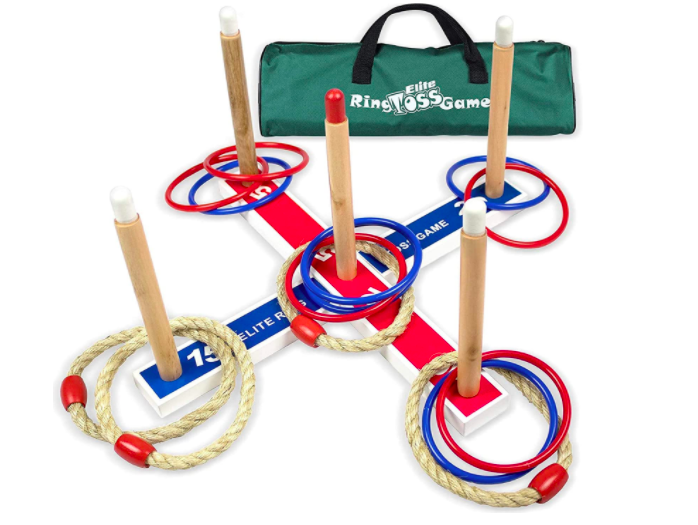 A ring toss game with five pegs and several rings for outdoor play even during winter.